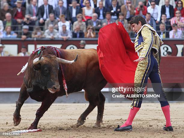 French matador Sebastian Castella performs a pass on a bull during the San Isidro Feria bullfight at the Las Ventas bullring in Madrid on May 29,...