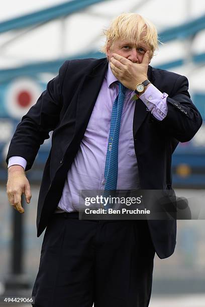 Mayor of London, Boris Johnson competes in a tug of war during the launch of London Poppy Day on October 27, 2015 in London, England. Poppies have...