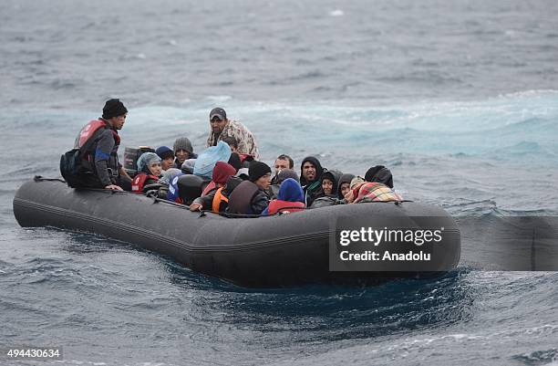 Refugees are seen on a boat after they rescued by Turkish coast guards while they were illegally trying to reach Greece's Lesbos island through the...