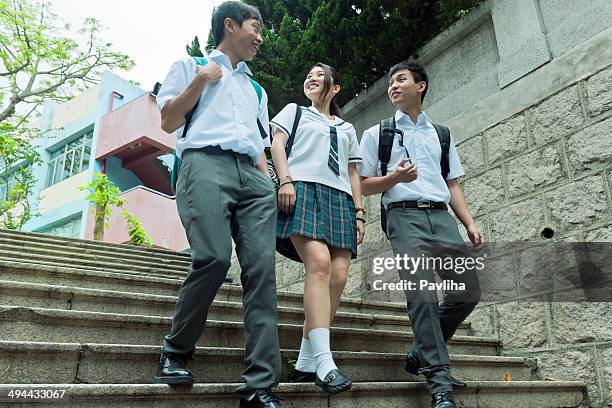 students walking in hong kong - bagpack stock pictures, royalty-free photos & images