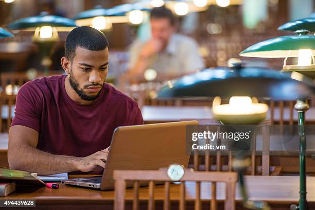 students studying in a library - studying library stock pictures, royalty-free photos & images