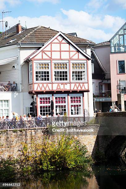 people on patio of cafe in kettwig - senior essen stock pictures, royalty-free photos & images