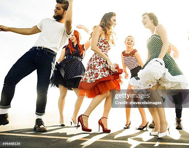 group of friends dancing. - swing dance stock pictures, royalty-free photos & images