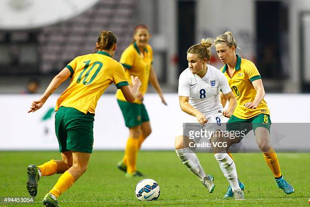 Isobel Christiansen of England and Emily van Egmond and Elise Kellond-Knight of Australia compete for the ball in the match between England and...
