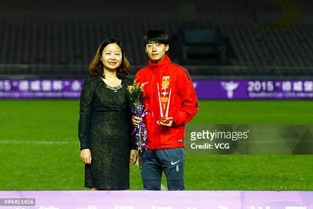 Li Dongna of China wins the Best Player after the 2015 Yongchuan Women's Football International Matches at Yongchuan Sports Center on October 27,...