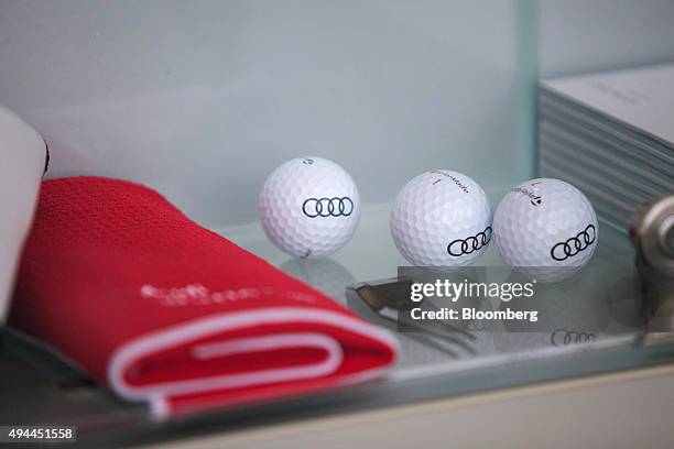 The Audi rings logo sits on golf balls in the gift shop at the Audi AG headquarters in Ingolstadt, Germany, on Monday, Oct. 26, 2015. The towns that...