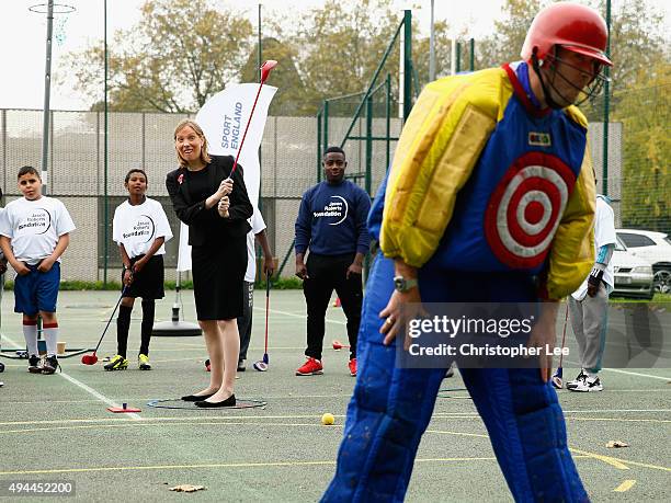 Minister of Sport, Tracey Crouch, aims at a target man as she takes part in Snag Golf as she visits the Sports Pavillion at The Hyde to Unveil New...