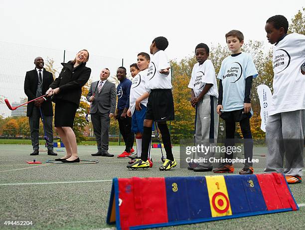 The Minister of Sport, Tracey Crouch, takes aim at a target as she takes part in Snag Golf with the Sport England Director of Community Sport, Mike...