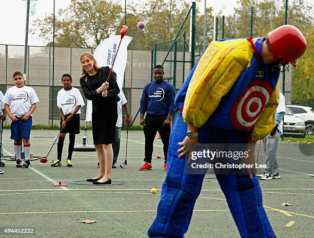 Minister of Sport, Tracey Crouch, aims at a target man as she takes part in Snag Golf as she visits the Sports Pavillion at The Hyde to Unveil New...