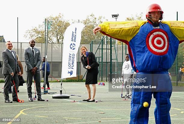 Minister of Sport, Tracey Crouch, aims at a target man as she takes part in Snag Golf as the Sport England Director of Community Sport, Mike Diaper...