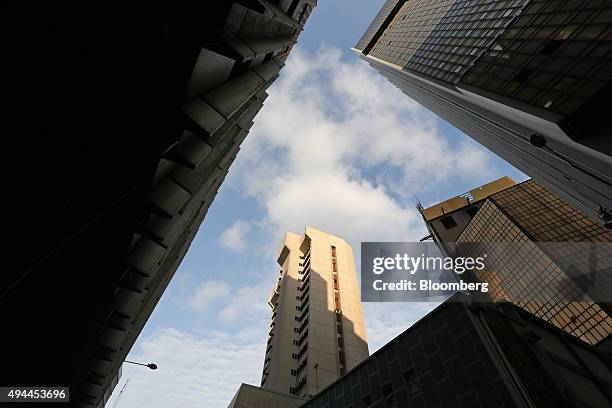 The headquarters of the Nigerian Stock Exchange , center, stands in the business district of Lagos, Nigeria, on Monday, Oct. 26, 2015. Nigeria plans...