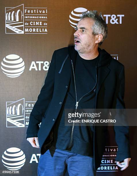 Mexican film director Alfonso Cuaron poses for a picture before the presentation of the movie "Desierto de Jonas" in the framework of the 13th...