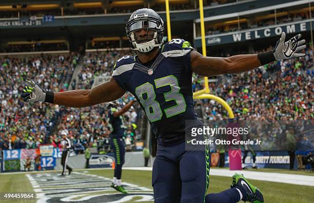 Wide receiver Ricardo Lockette of the Seattle Seahawks gestures to the crowd during the game against the Carolina Panthers at CenturyLink Field on...