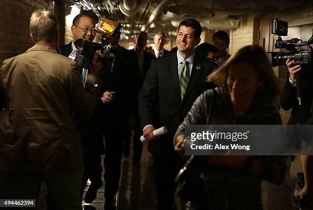 Rep. Paul Ryan is surrounded by members of the media as he leaves after a House Republican Caucus meeting October 27, 2015 at the Capitol in...