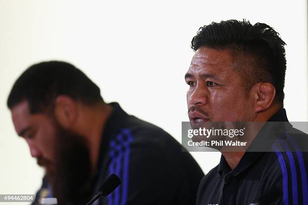 Keven Mealamu of the All Blacks speaks alongside Charlie Faumuina during a New Zealand All Blacks media session on October 27, 2015 in Bagshot,...