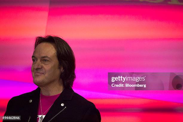 John Legere, chief executive officer of T-Mobile US Inc., waits to ring the opening bell at the Nasdaq MarketSite in New York, U.S., on Tuesday, Oct....