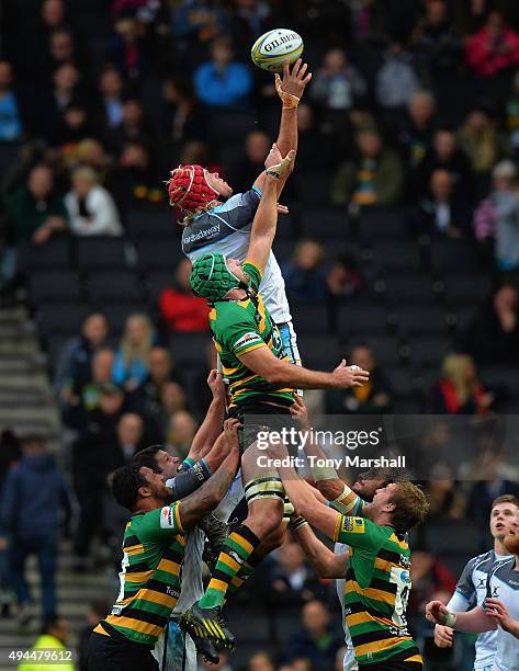 Michael Paterson of Northampton Saints challenges Mouritz Botha of Newcastle Falcons in the line out during the Aviva Premiership match between...