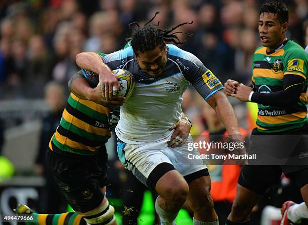 Michael Paterson of Northampton Saints tackles Alesana Tuilagi of Newcastle Falcons during the Aviva Premiership match between Northampton Saints and...