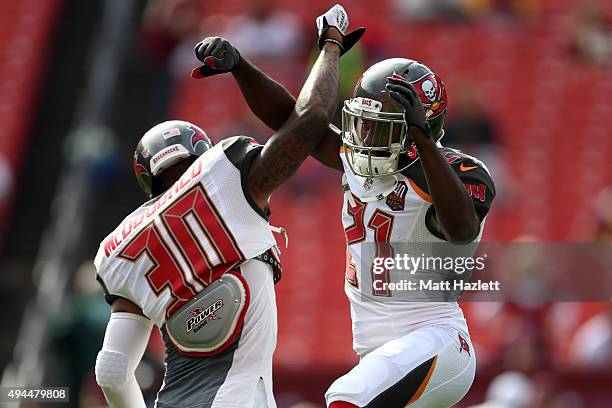 Free safety Bradley McDougald of the Tampa Bay Buccaneers and cornerback Alterraun Verner of the Tampa Bay Buccaneers warm up before a game against...