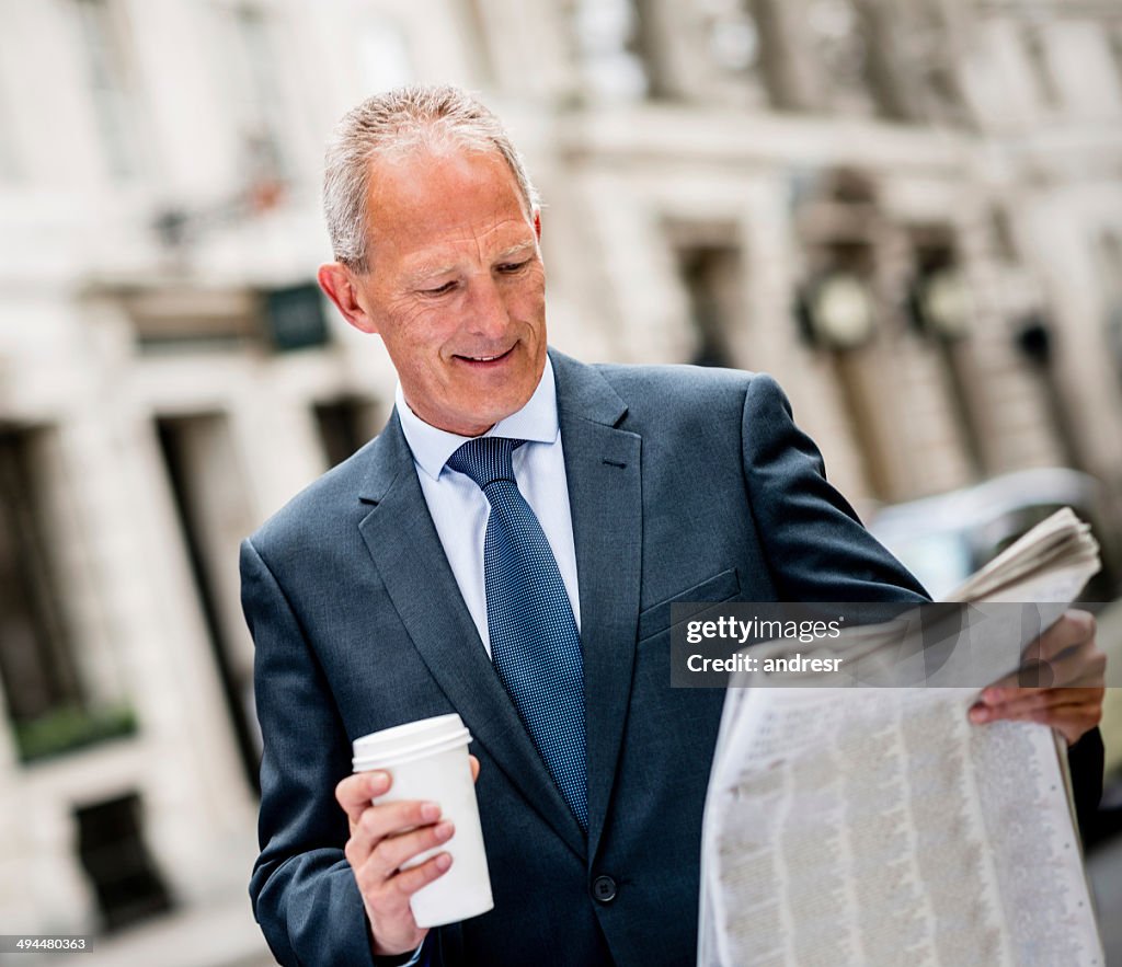 Business man reading the news