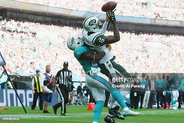 Wide Receiver Brandon Marshall of the New York Jets goes up for a ball against the Miami Dolphins at Wembley Stadium on October 4, 2015 in London,...