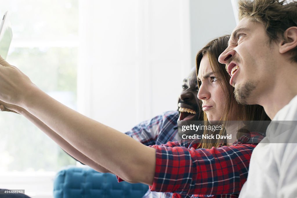 Friends looking at tablet
