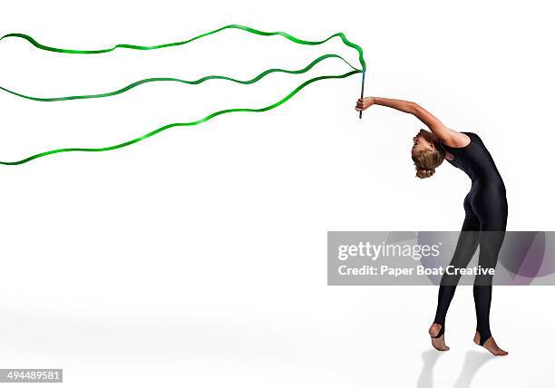 dancer holding a set of three green ribbons - ribbon dance stock pictures, royalty-free photos & images