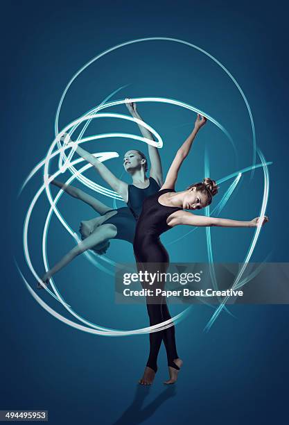 gymnast in 3 split second motions, with light rays - long exposure dance stock pictures, royalty-free photos & images