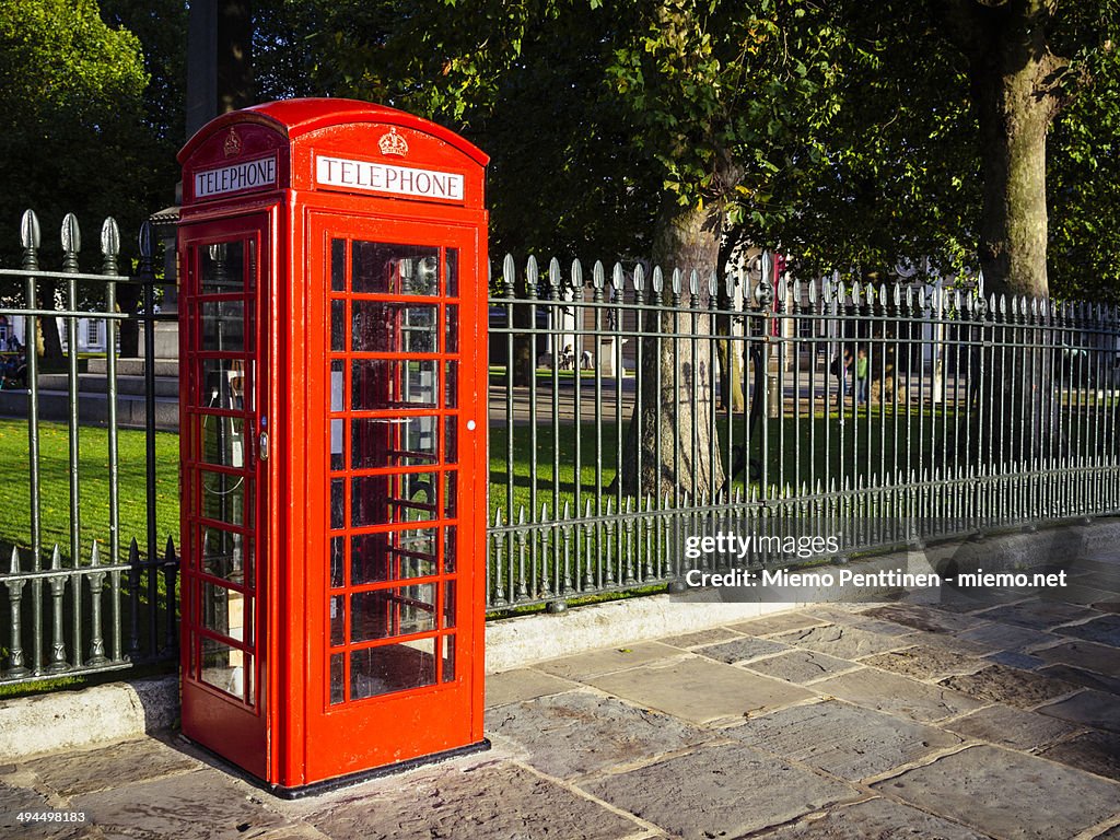 The iconic red UK telephone box.