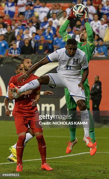 Turkey goalkeeper Zengin Tolga catches the ball in front of Jerry Bengston of Honduras during a World Cup preparation friendly match at RFK Stadium...