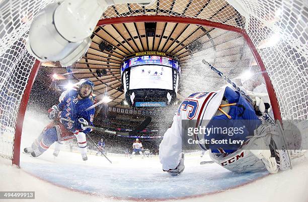 Mats Zuccarello of the New York Rangers watches as Dustin Tokarski of the Montreal Canadiens stops a shot on goal in the first period of Game Six of...