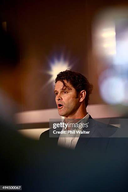 Chris Cairns reads a prepared statement to the media at a press conference at Auckland Airport on May 30, 2014 in Auckland, New Zealand. Cairns has...