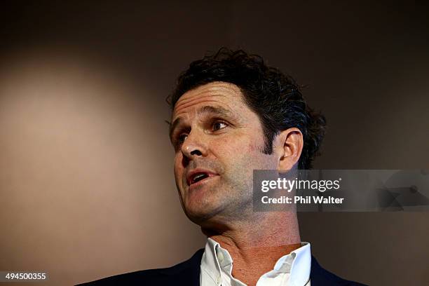 Chris Cairns reads a prepared statement to the media at a press conference at Auckland Airport on May 30, 2014 in Auckland, New Zealand. Cairns has...