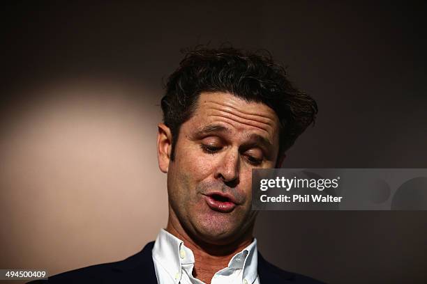 Chris Cairns reads a prepared statement to the media at a press conference at Auckland Airport on May 30, 2014 in Auckland, New Zealand. Cairns has...