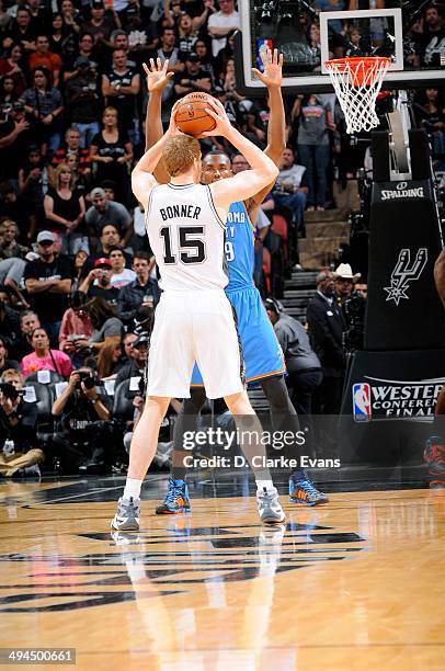 Matt Bonner of the San Antonio Spurs handles the ball against Serge Ibaka of the Oklahoma City Thunder in Game Five of the Western Conference Finals...