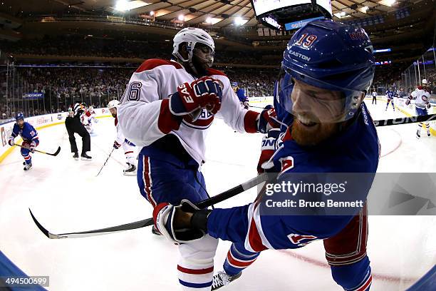 Subban of the Montreal Canadiens gets tangled up with Brad Richards of the New York Rangers along the boards during Game Six of the Eastern...