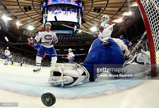 Dustin Tokarski of the Montreal Canadiens looks on after giving up a second period goal to Dominic Moore of the New York Rangers at 18:07 during Game...
