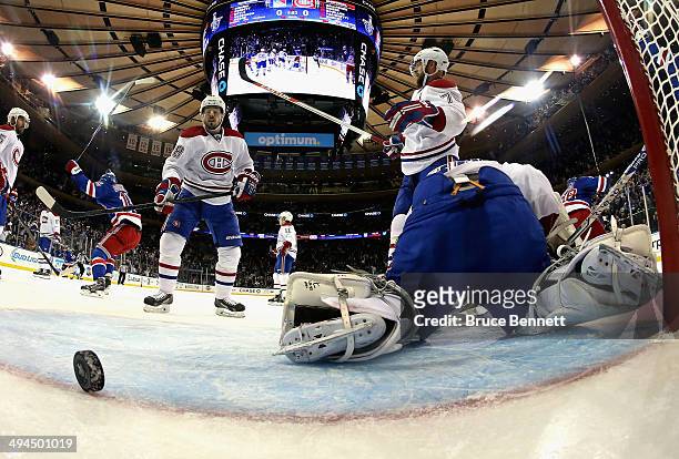 Dustin Tokarski of the Montreal Canadiens looks on after giving up a second period goal to Dominic Moore of the New York Rangers at 18:07 during Game...