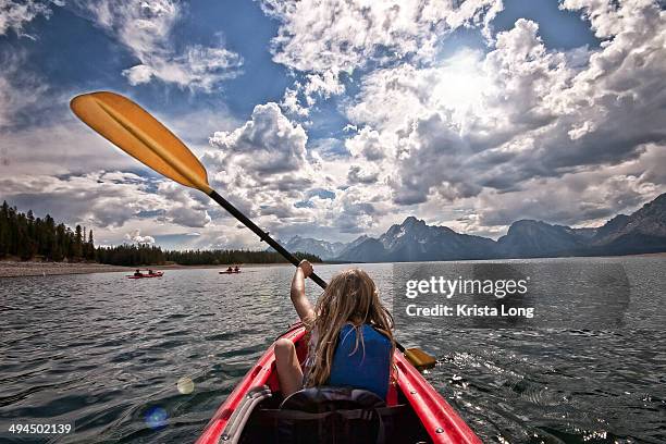 a girl kayaking on a summer day - jackson wyoming foto e immagini stock