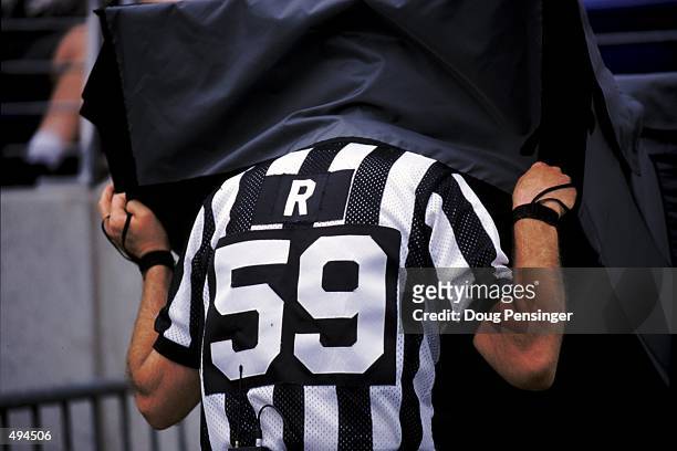 View of an referee taking a second look at the instant replay during the game between the Baltimore Ravens and the New York Giants at Camden Yards in...