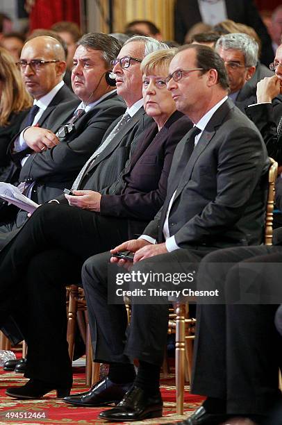 French President Francois Hollande, German Federal Chancellor Angela Merkel and European Commission President Jean-Claude Juncker attend a...