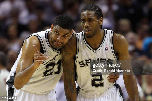 Tim Duncan and Kawhi Leonard of the San Antonio Spurs talk in the second quarter against the Oklahoma City Thunder during Game Five of the Western...