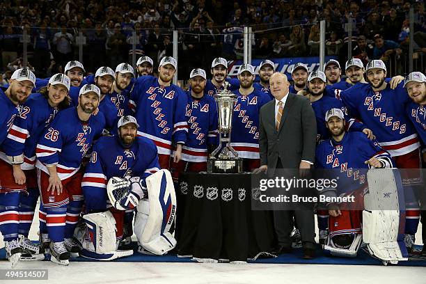 The New York Rangers pose with Deputy Commissioner Bill Daly and the Prince of Wales Trophy after defeating the Montreal Canadiens in Game Six to win...