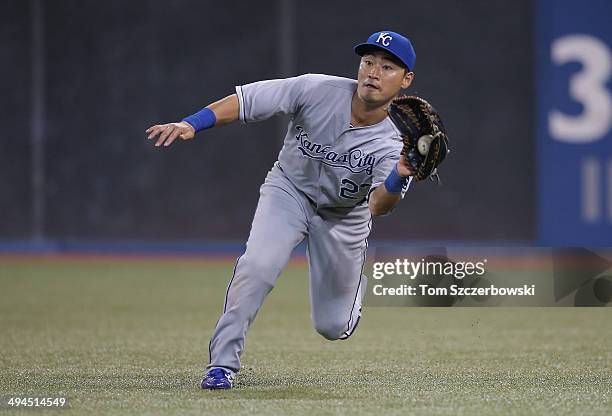 Norichika Aoki of the Kansas City Royals makes a running catch in the tenth inning during MLB game action against the Toronto Blue Jays on May 29,...