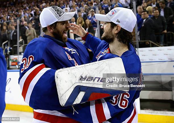 Henrik Lundqvist and Mats Zuccarello of the New York Rangers celebrates after defeating the Montreal Canadiens in Game Six to win the Eastern...