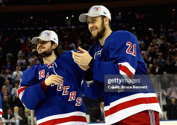 Derek Stepan and Mats Zuccarello of the New York Rangers celebrates after defeating the Montreal Canadiens in Game Six to win the Eastern Conference...