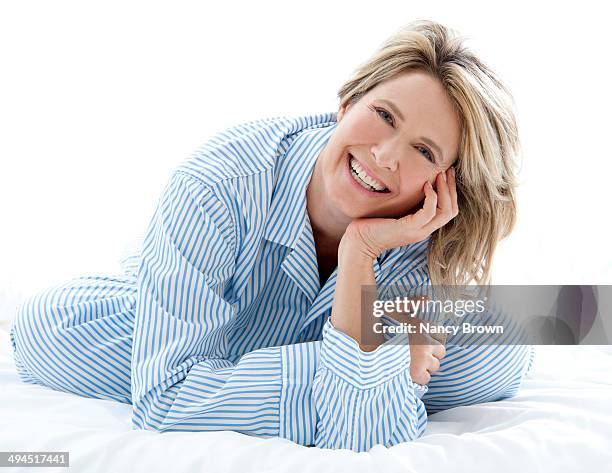 middle age head shot in bed - nightwear stock pictures, royalty-free photos & images