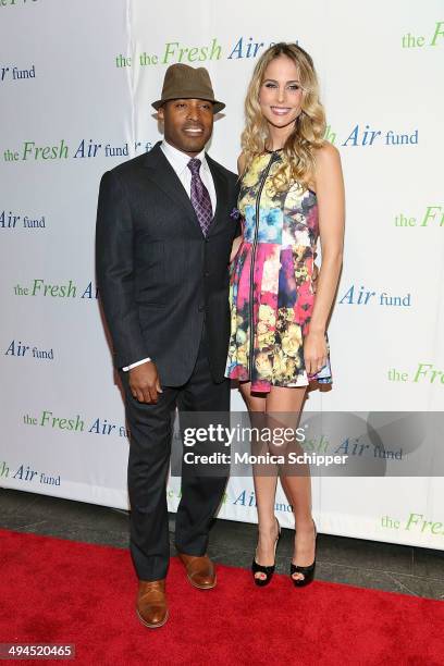 Former professional football player Tiki Barber and Traci Lynn Johnson attend the 2014 Fresh Air Fund Honoring Our American Hero at Pier Sixty at...