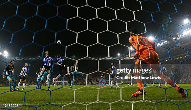 Lucas Joao of Sheffield Wednesday rises above the Arsenal defence to score his team's second goal during the Capital One Cup fourth round match...