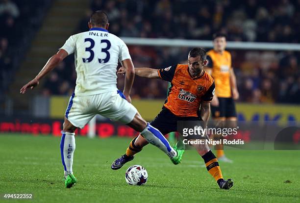 Shaun Maloney of Hull City challenges Gokhan Inler of Leicester City during the Capital One Cup Fourth Round match between Hull City and Leicester...